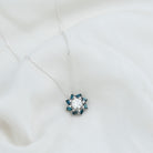 Round Moissanite Designer Floral Inspired Pendant with London Blue Topaz D-VS1 8 MM - Sparkanite Jewels